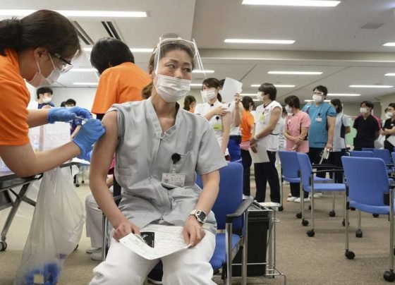 Japan's foreign residents may travel to other countries for Covid-19 vaccines